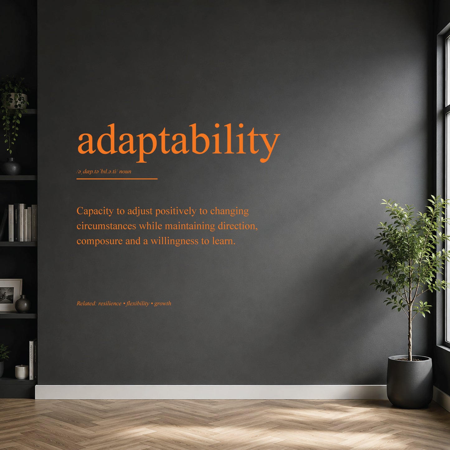 White adaptability definition wall sticker on a dark modern wall.