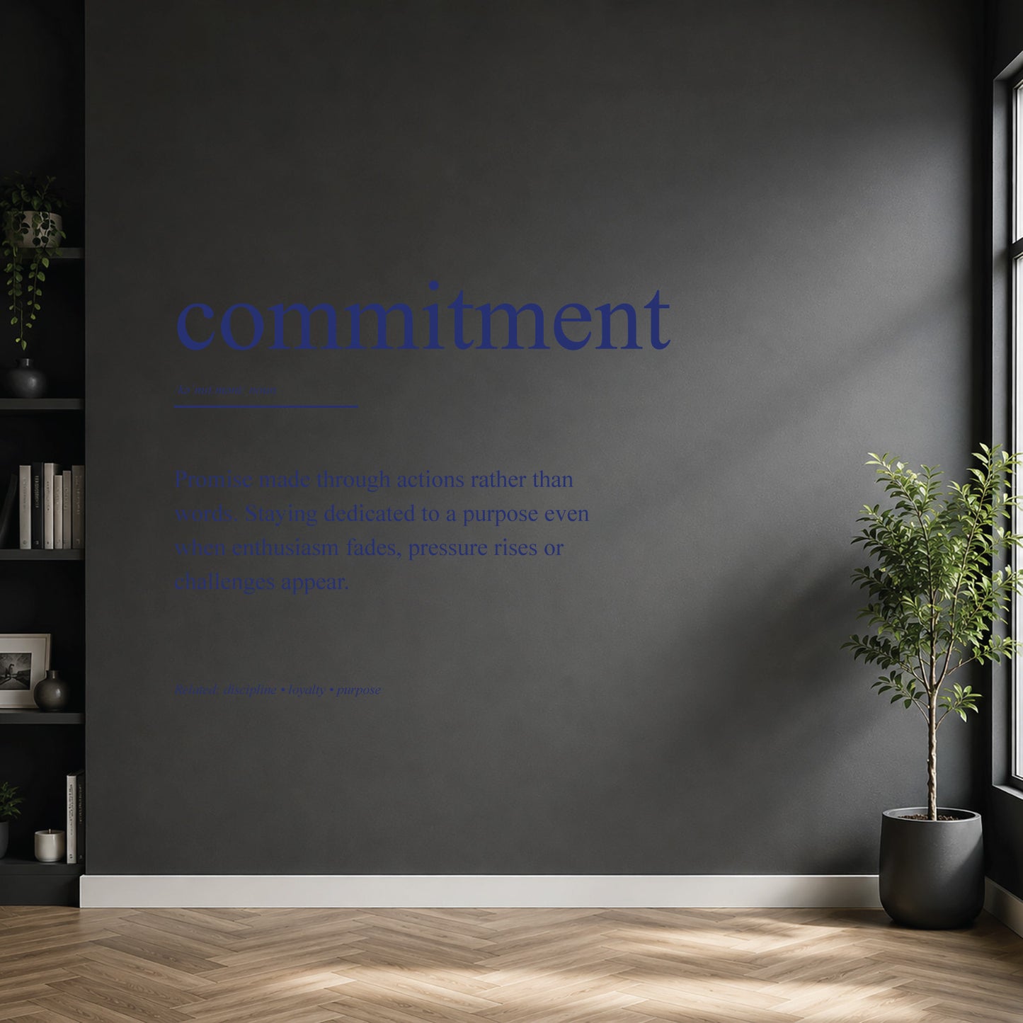 White commitment definition wall sticker on a dark modern wall.