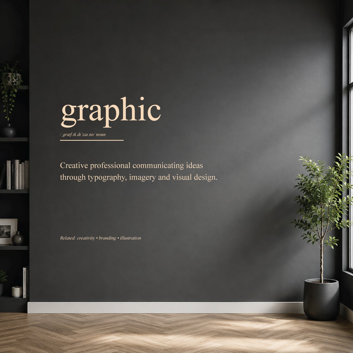White graphic designer definition wall sticker on a dark modern wall.