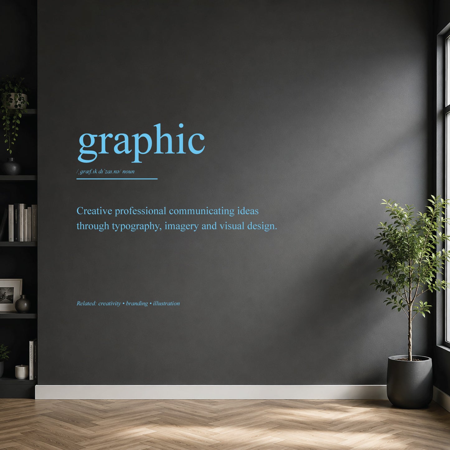 White graphic designer definition wall sticker on a dark modern wall.