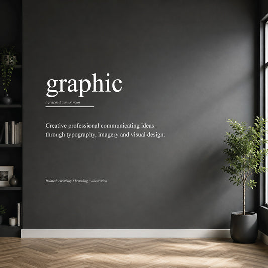 White graphic designer definition wall sticker on a dark modern wall.