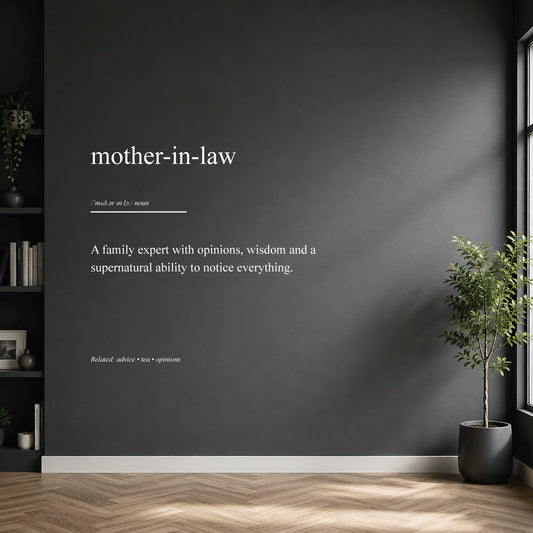 White mother-in-law dictionary definition wall sticker on a dark modern wall.
