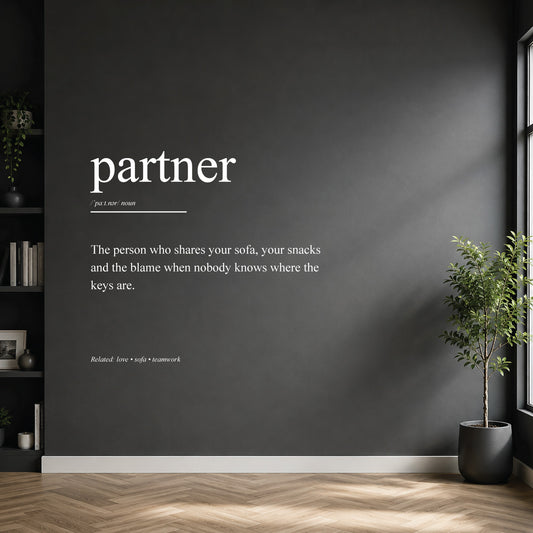 White partner dictionary definition wall sticker on a dark modern wall.