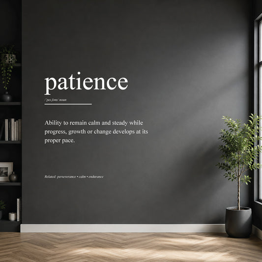 White patience definition wall sticker on a dark modern wall.